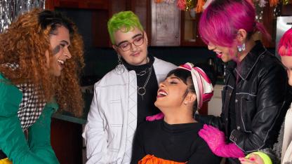 A group of friends of varying genders celebrating